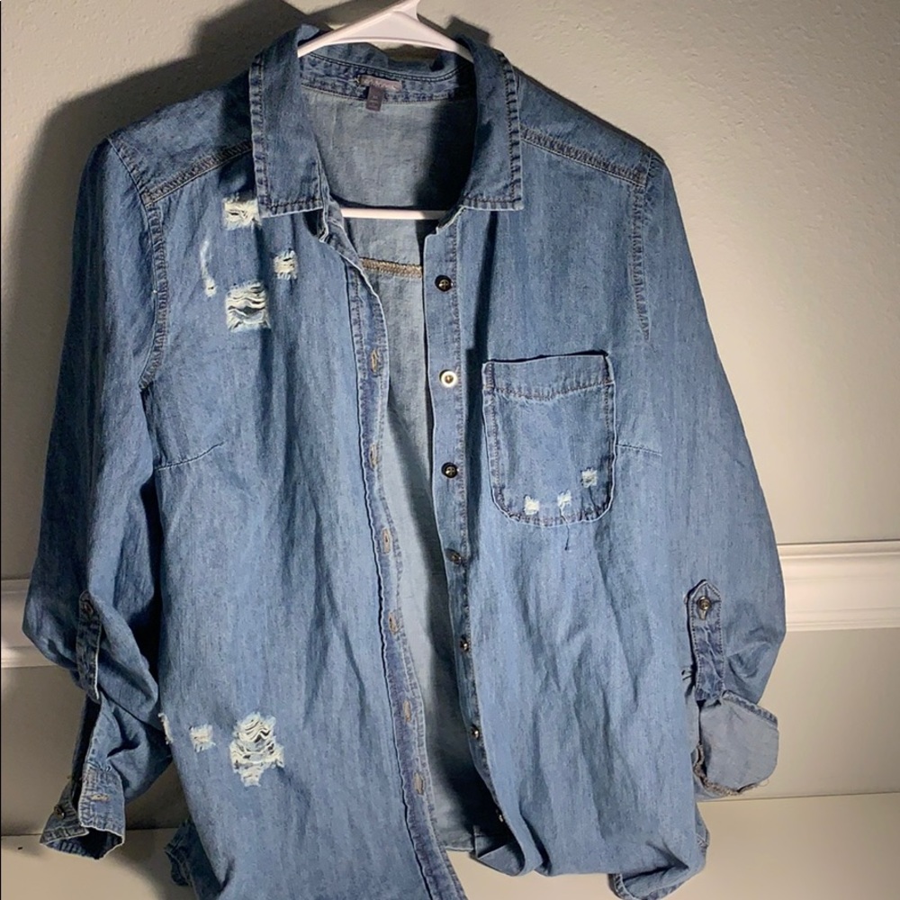 A ripped Jean jacket looking flannel